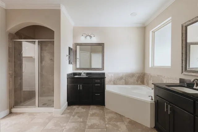 a bathroom with a bathtub and a sink
