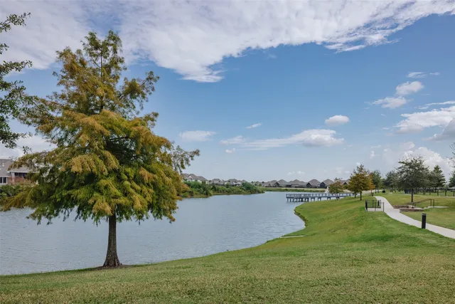 a view of a lake with a yard
