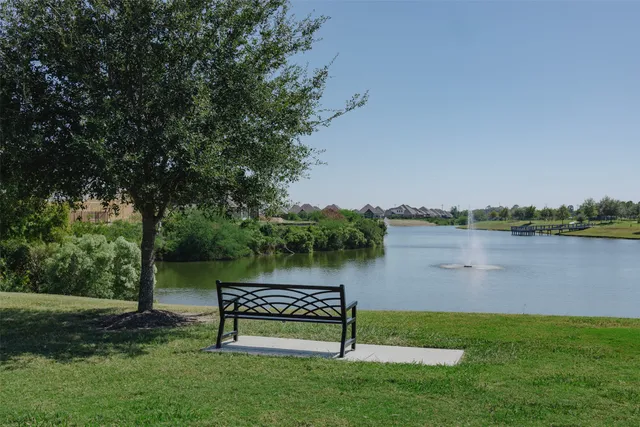 a view of a lake with a bench and a lake view