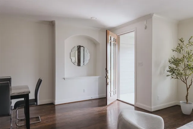 a view of a livingroom with furniture and wooden floor
