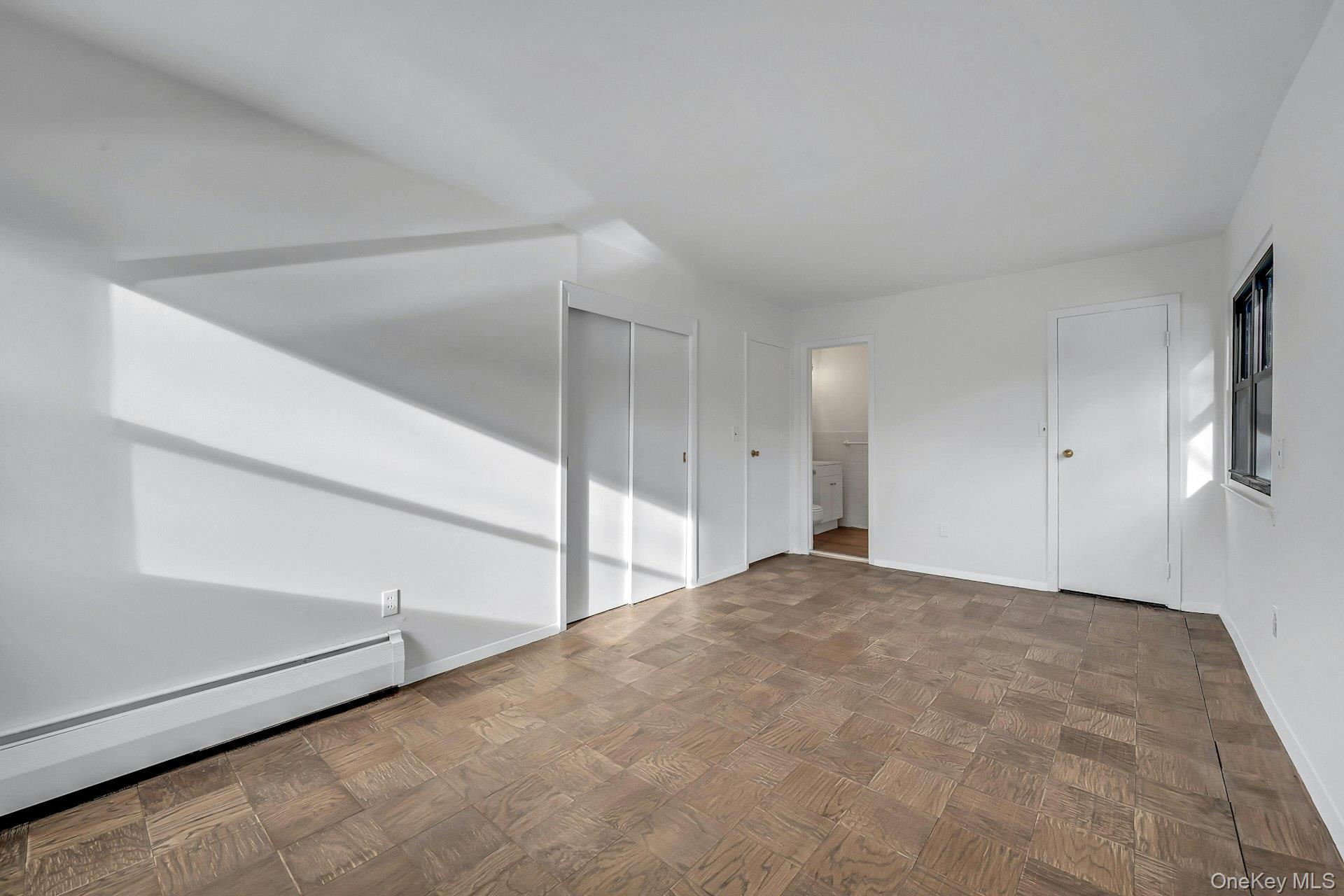 2261 Palmer Avenue, Unit 2M New Rochelle, NY 10801 - Photo 15 of 22 Primary bedroom with a walk-in closet and a double closet