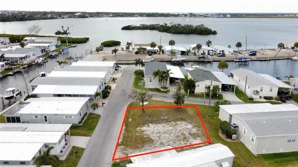 an aerial view of a house with lake view