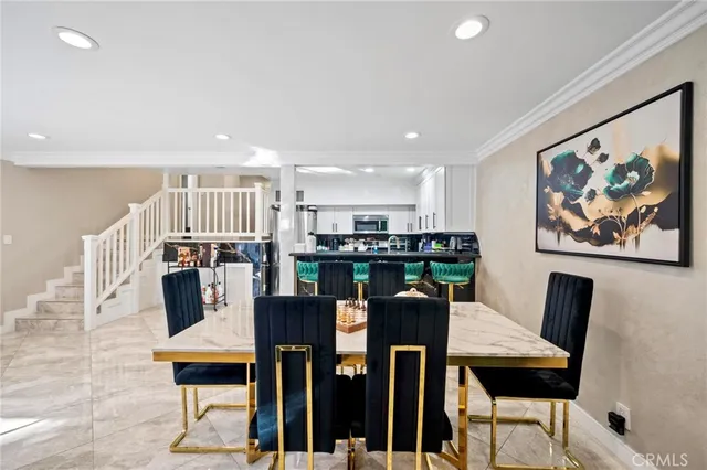 a dining room with furniture and wooden floor