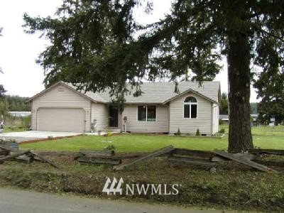 4225 183rd Avenue Southwest Rochester, WA 98579 - Photo 1 of 1 a white house that has a tree in front of it
