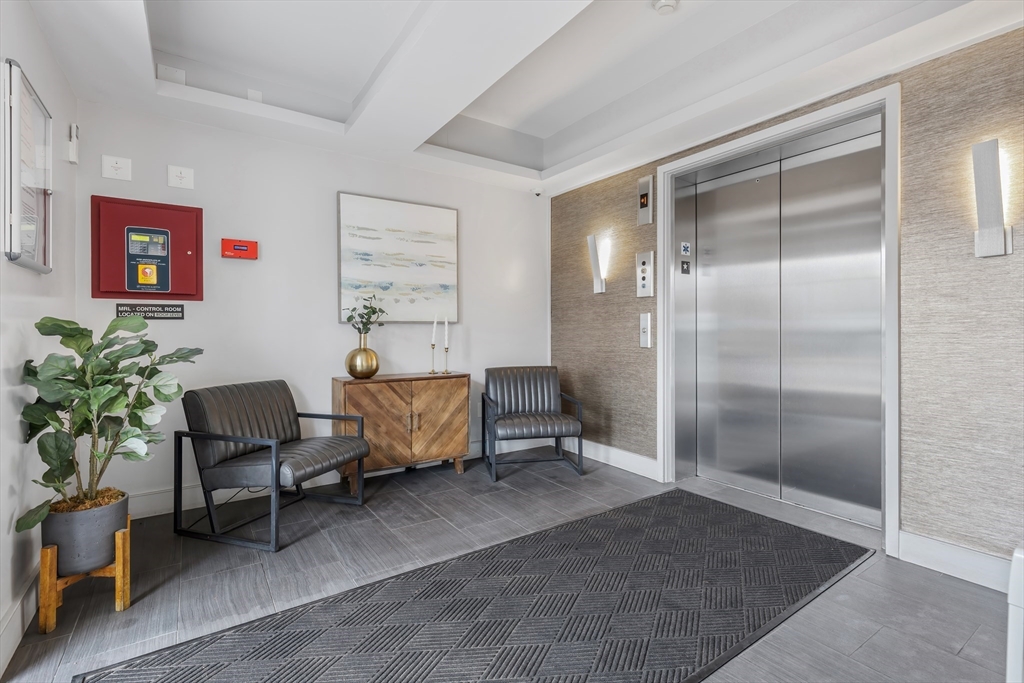70 Bremen Street, Unit 501 Boston, MA 02128 - Photo 13 of 15 a living room with furniture
