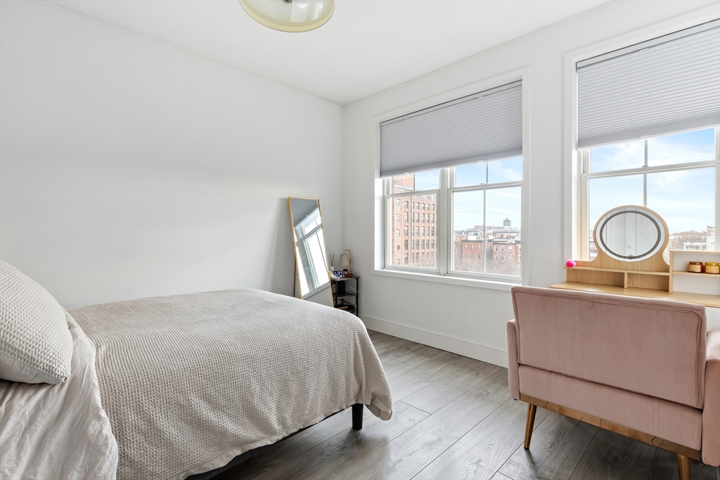 70 Bremen Street, Unit 501 Boston, MA 02128 - Photo 6 of 15 a bed sitting in a bedroom next to a window