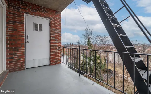 a view of a balcony with staircase