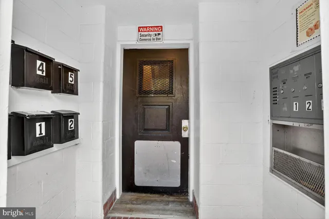 a view of a hallway with some storage and utility