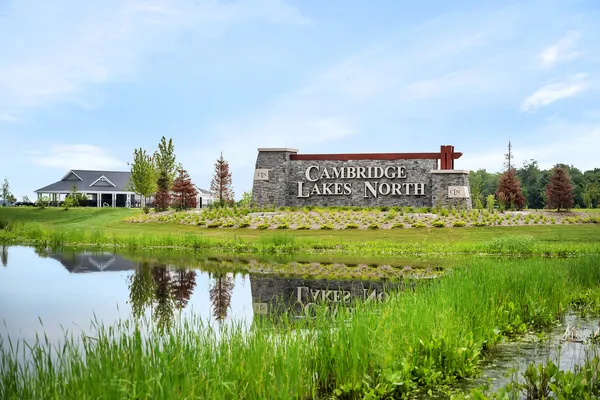 a view of a park with a building in the background