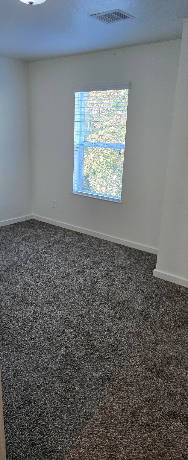 21155 Gosling Road, Unit 49 Spring, TX 77388 - Photo 5 of 11 an empty room with windows