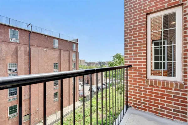 a view of a balcony with a floor to ceiling window
