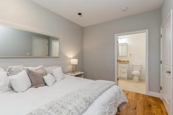 a bedroom with a bed and walk in closet