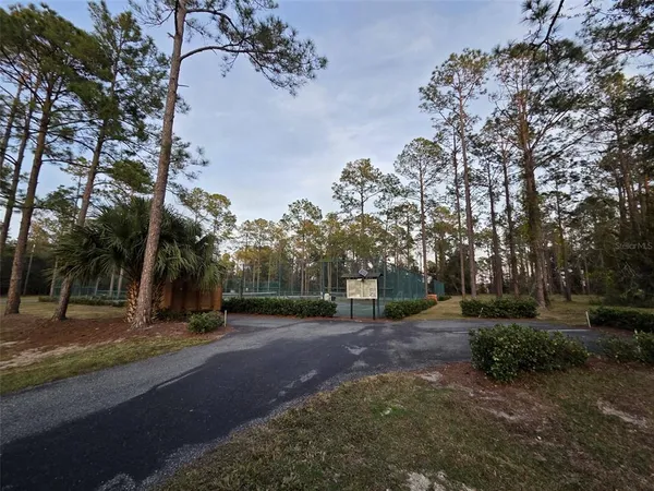a view of a playground with basketball court