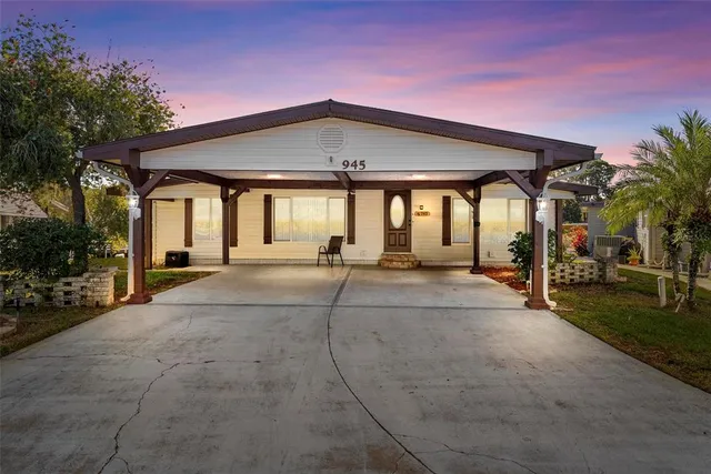 a view of a house with entertaining space and covered with trees