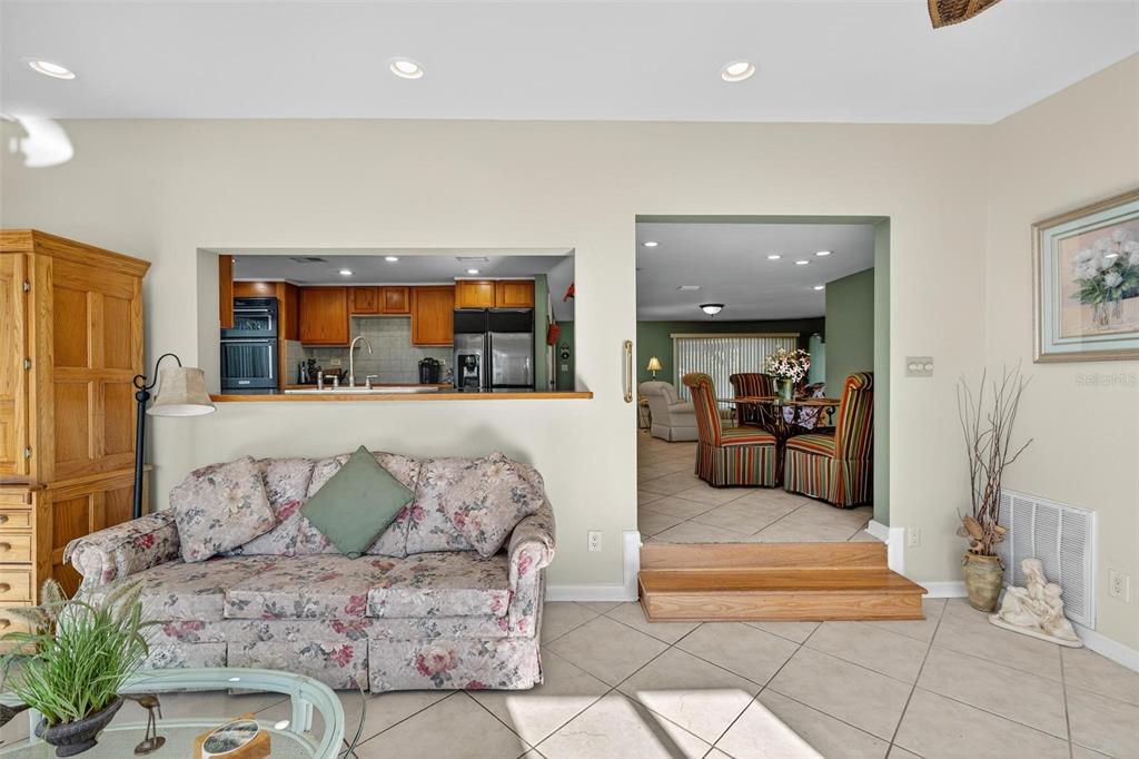 945 Todd Way Tavares, FL 32778 - Photo 14 of 75 a living room with furniture and a large window