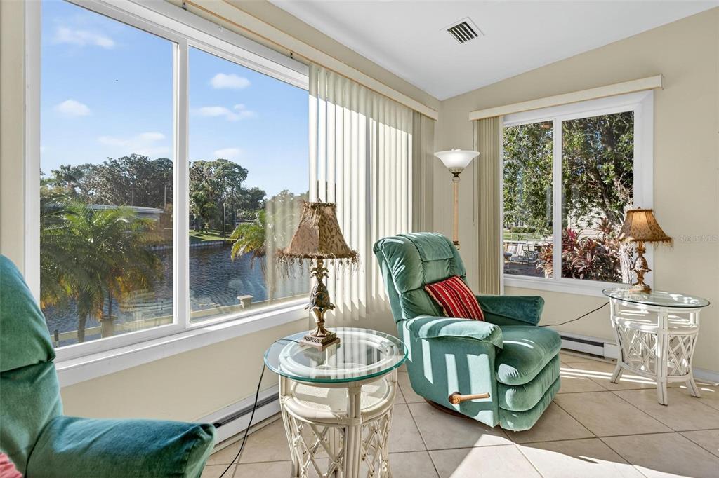 945 Todd Way Tavares, FL 32778 - Photo 15 of 75 a living room with fireplace furniture and a potted plant
