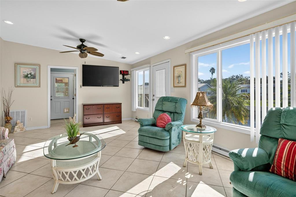 945 Todd Way Tavares, FL 32778 - Photo 16 of 75 a living room with furniture and a fireplace