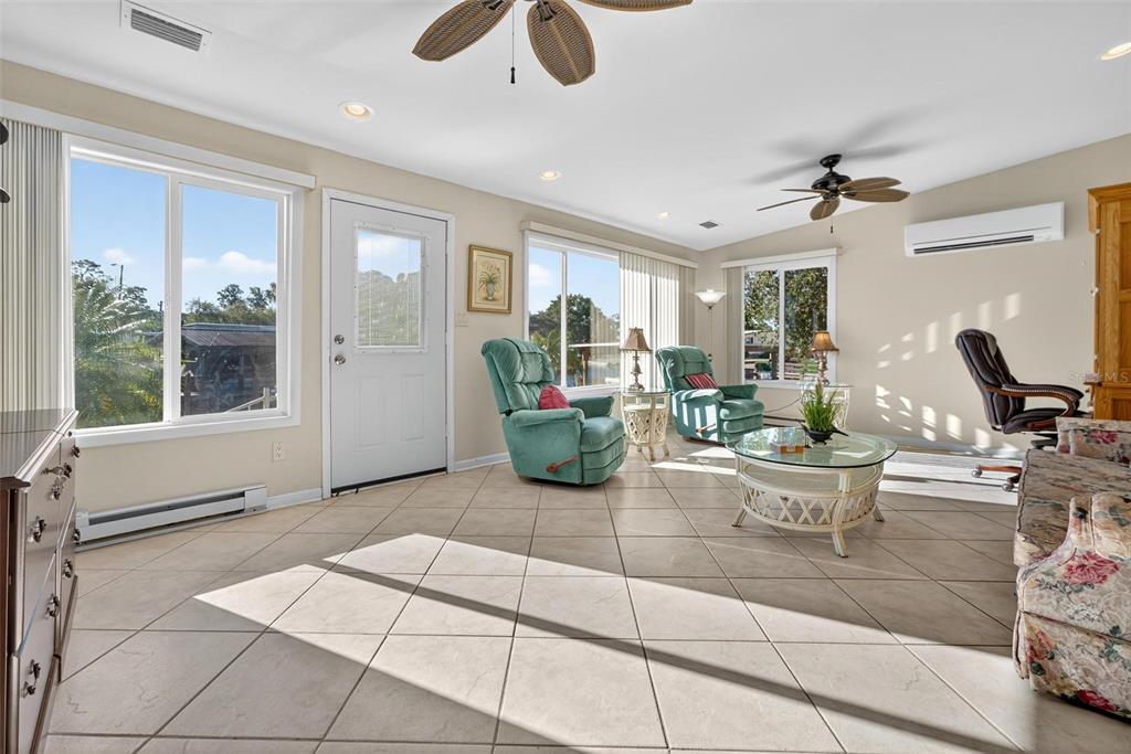 945 Todd Way Tavares, FL 32778 - Photo 17 of 75 a living room with patio furniture and a potted plant