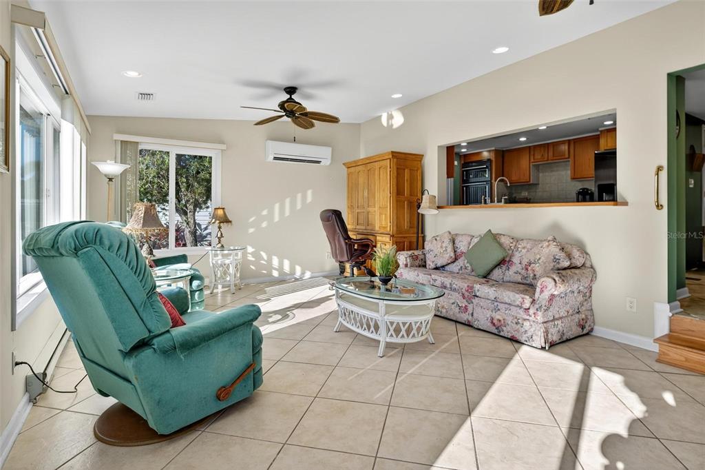 945 Todd Way Tavares, FL 32778 - Photo 20 of 75 a living room with furniture and a large window