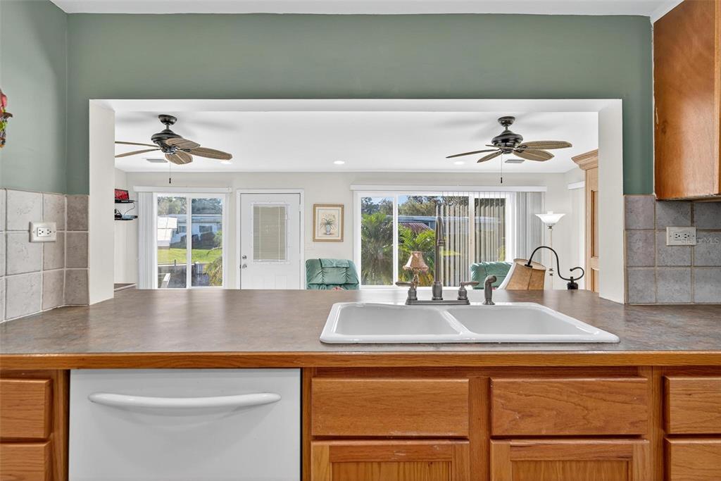 945 Todd Way Tavares, FL 32778 - Photo 25 of 75 a kitchen with a sink and a large window