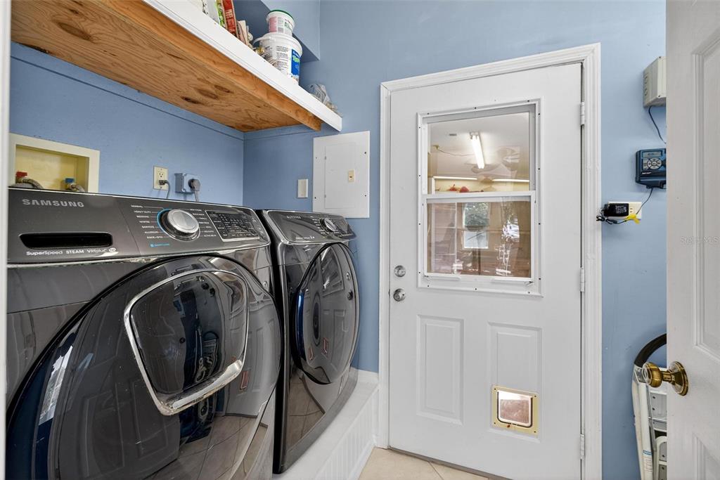 945 Todd Way Tavares, FL 32778 - Photo 28 of 75 a utility room with dryer and washer