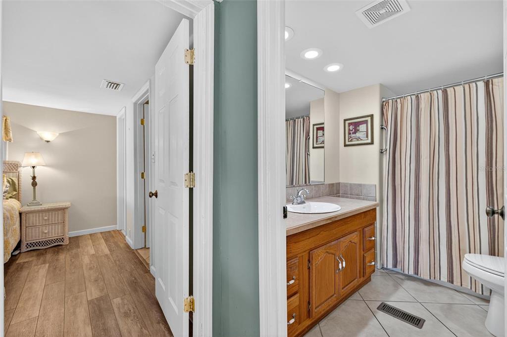 945 Todd Way Tavares, FL 32778 - Photo 29 of 75 a spacious bathroom with a granite countertop sink a mirror and a bathtub