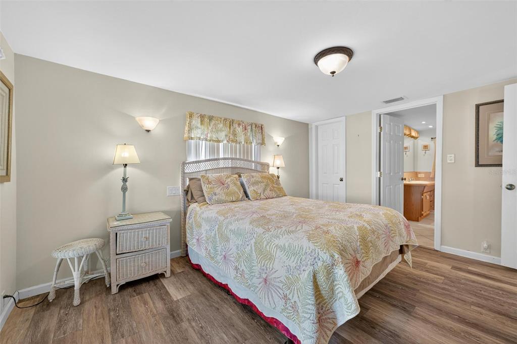 945 Todd Way Tavares, FL 32778 - Photo 30 of 75 a bedroom with a bed and a table