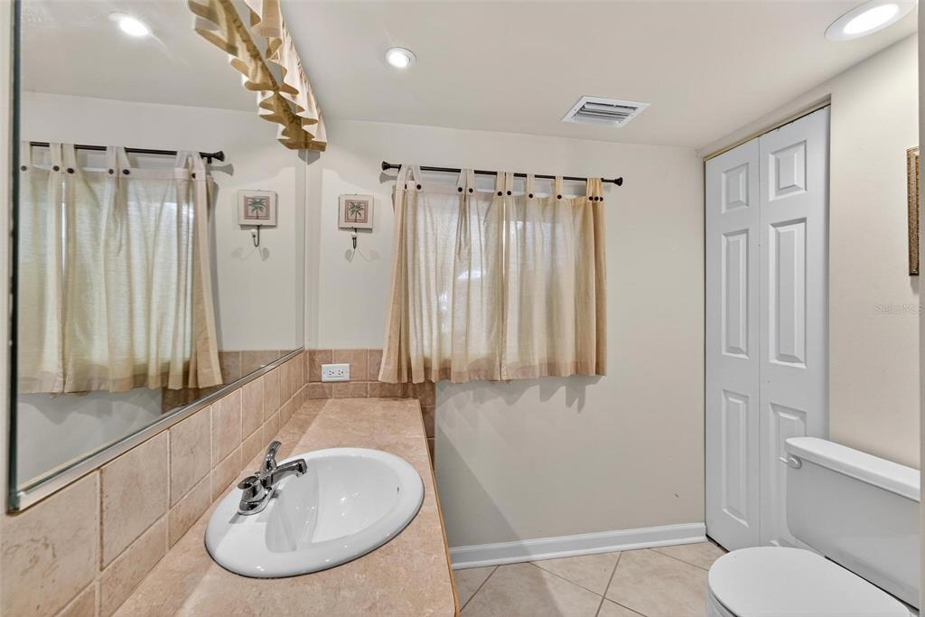 945 Todd Way Tavares, FL 32778 - Photo 36 of 75 a bathroom with a sink toilet and shower