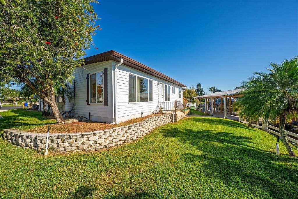 945 Todd Way Tavares, FL 32778 - Photo 48 of 75 a front view of a house with a yard