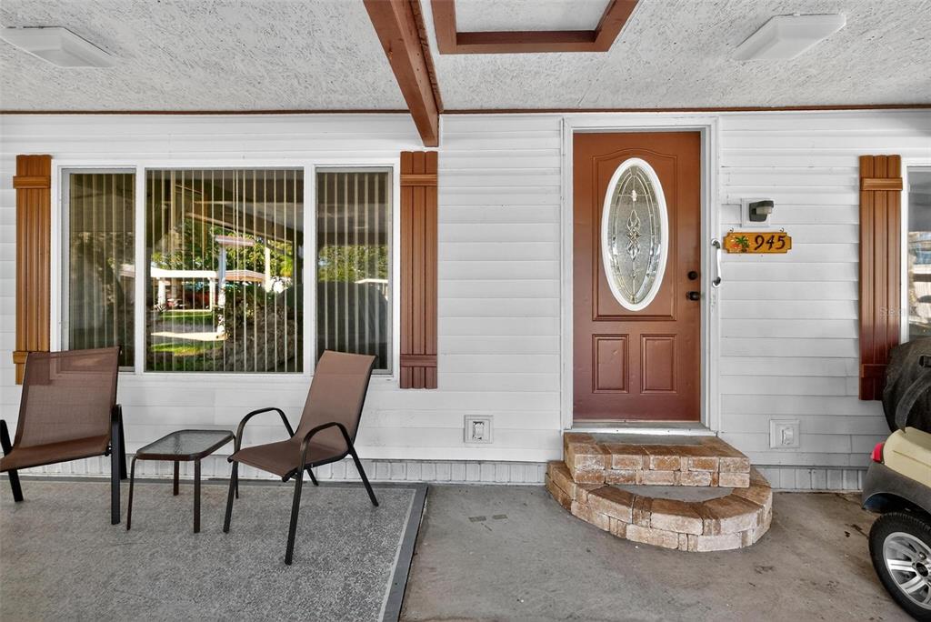 945 Todd Way Tavares, FL 32778 - Photo 5 of 75 a living room with furniture a window and a potted plant