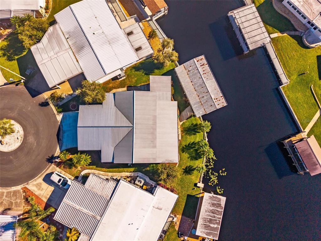 945 Todd Way Tavares, FL 32778 - Photo 57 of 75 an aerial view of a house with a yard and a barbeque
