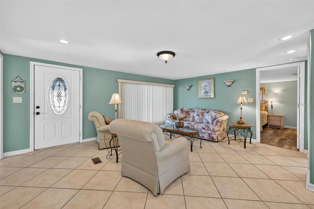 945 Todd Way Tavares, FL 32778 - Photo 6 of 75 a living room with furniture and a table