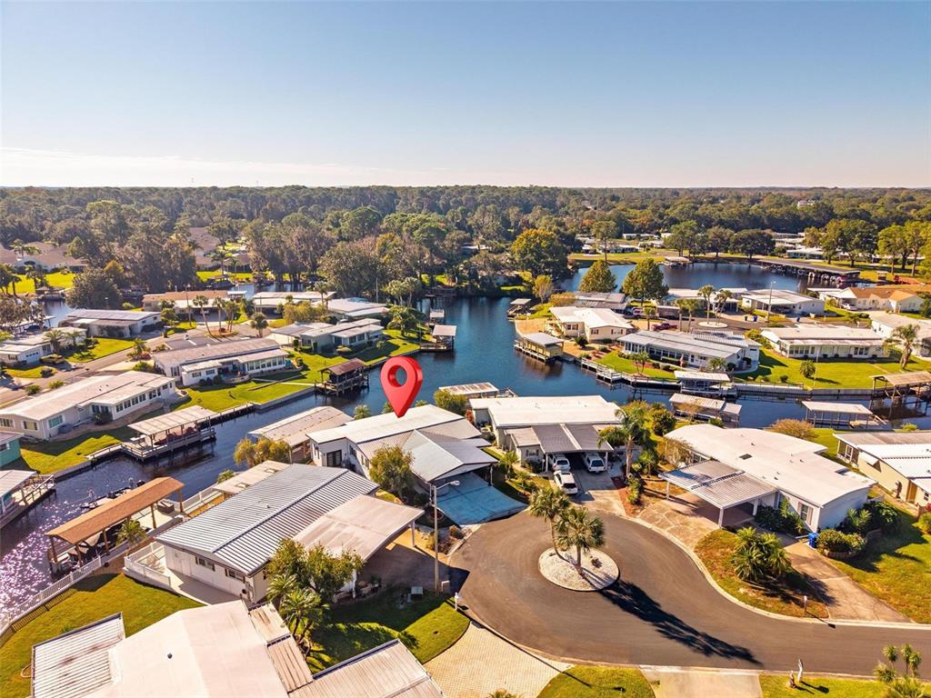945 Todd Way Tavares, FL 32778 - Photo 61 of 75 an aerial view of a houses with a swimming pool