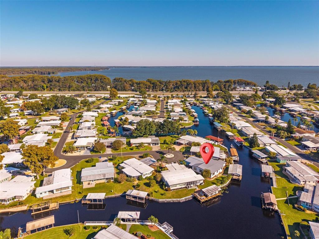 945 Todd Way Tavares, FL 32778 - Photo 66 of 75 an aerial view of residential houses with outdoor space