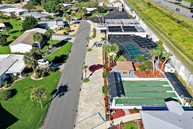 945 Todd Way Tavares, FL 32778 - Photo 74 of 75 an aerial view of a house with a yard and greenery