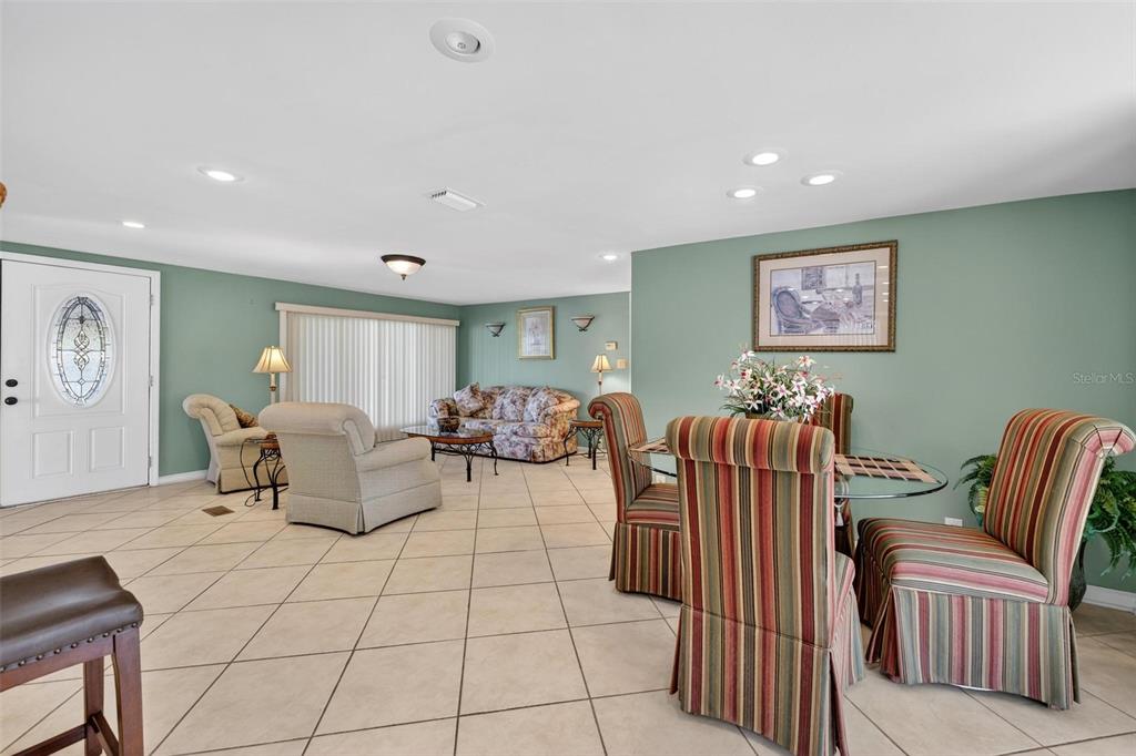 945 Todd Way Tavares, FL 32778 - Photo 8 of 75 a living room with furniture and a window