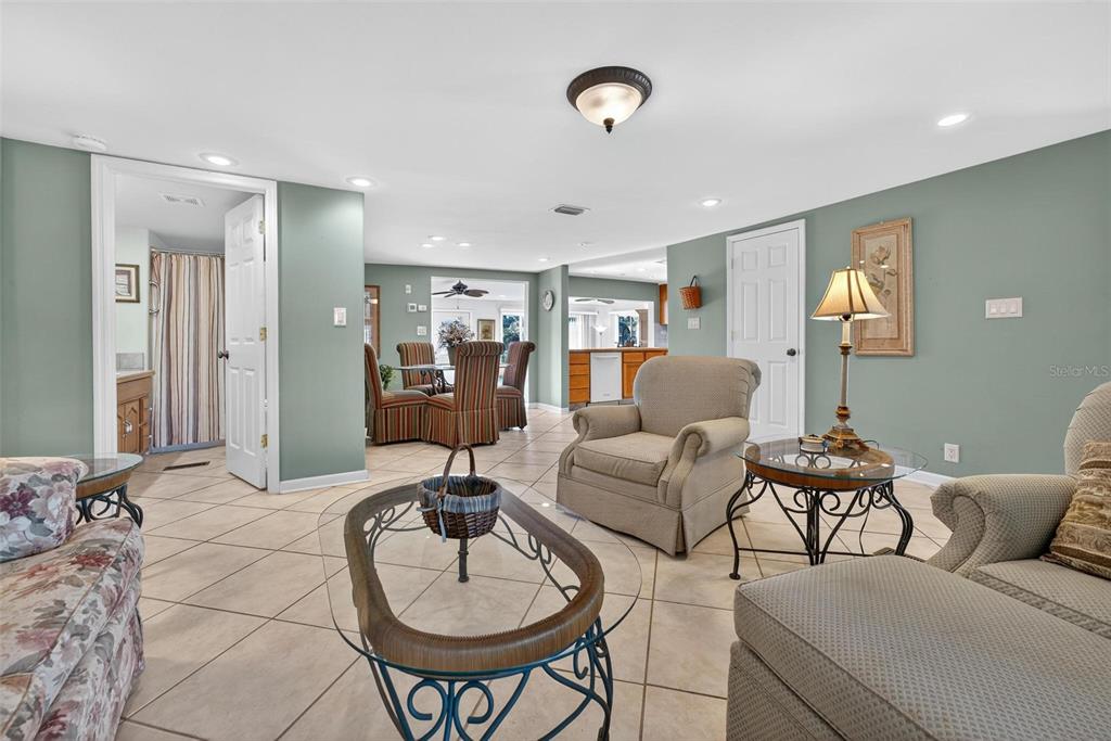 945 Todd Way Tavares, FL 32778 - Photo 9 of 75 a living room with furniture and wooden floor