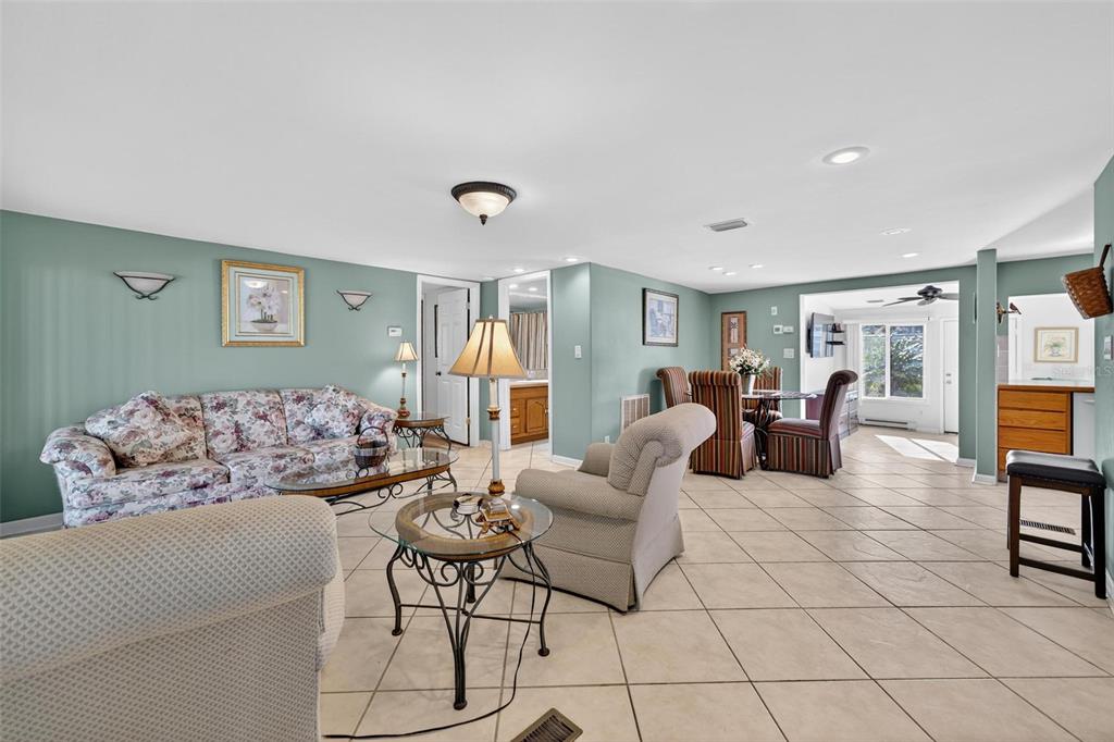 945 Todd Way Tavares, FL 32778 - Photo 10 of 75 a living room with furniture and a table