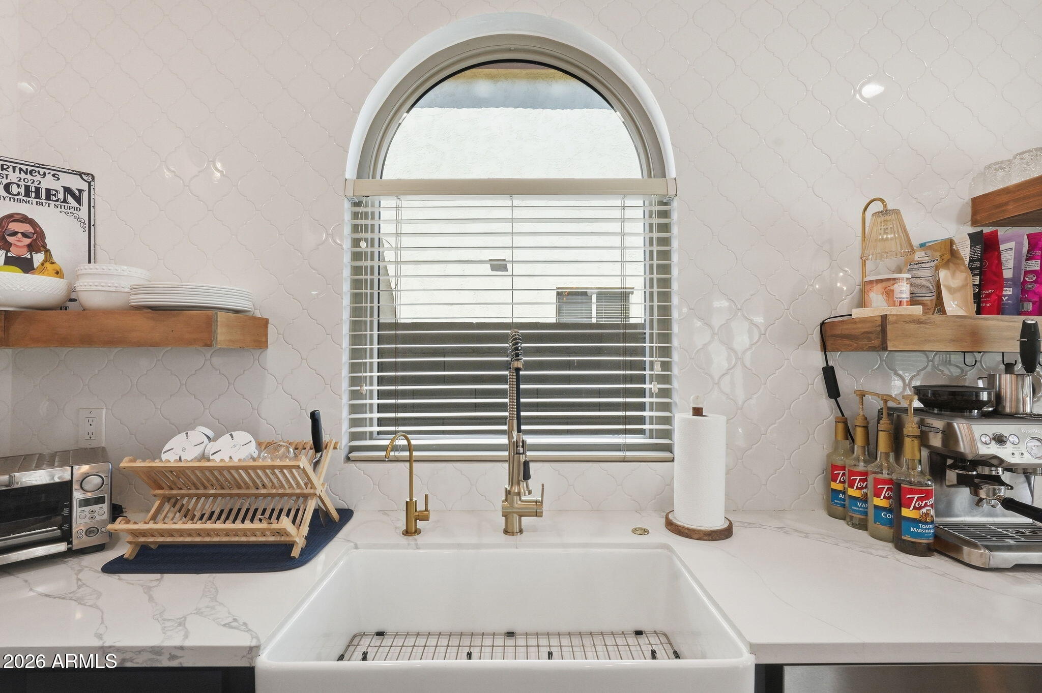 4184 East Trigger Way Gilbert, AZ 85297 - Photo 14 of 51 a kitchen with furniture and a window