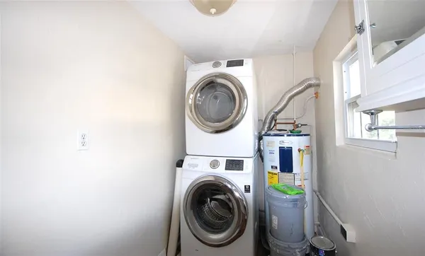 a blue sign that is sitting on a wooden wall