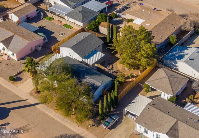 an aerial view of a house with a yard