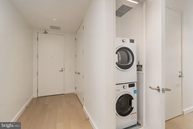a utility room with sink dryer and washer
