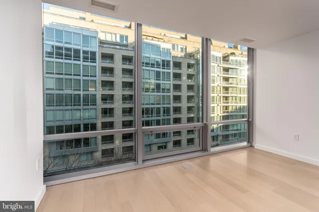 a view of an empty room with a balcony
