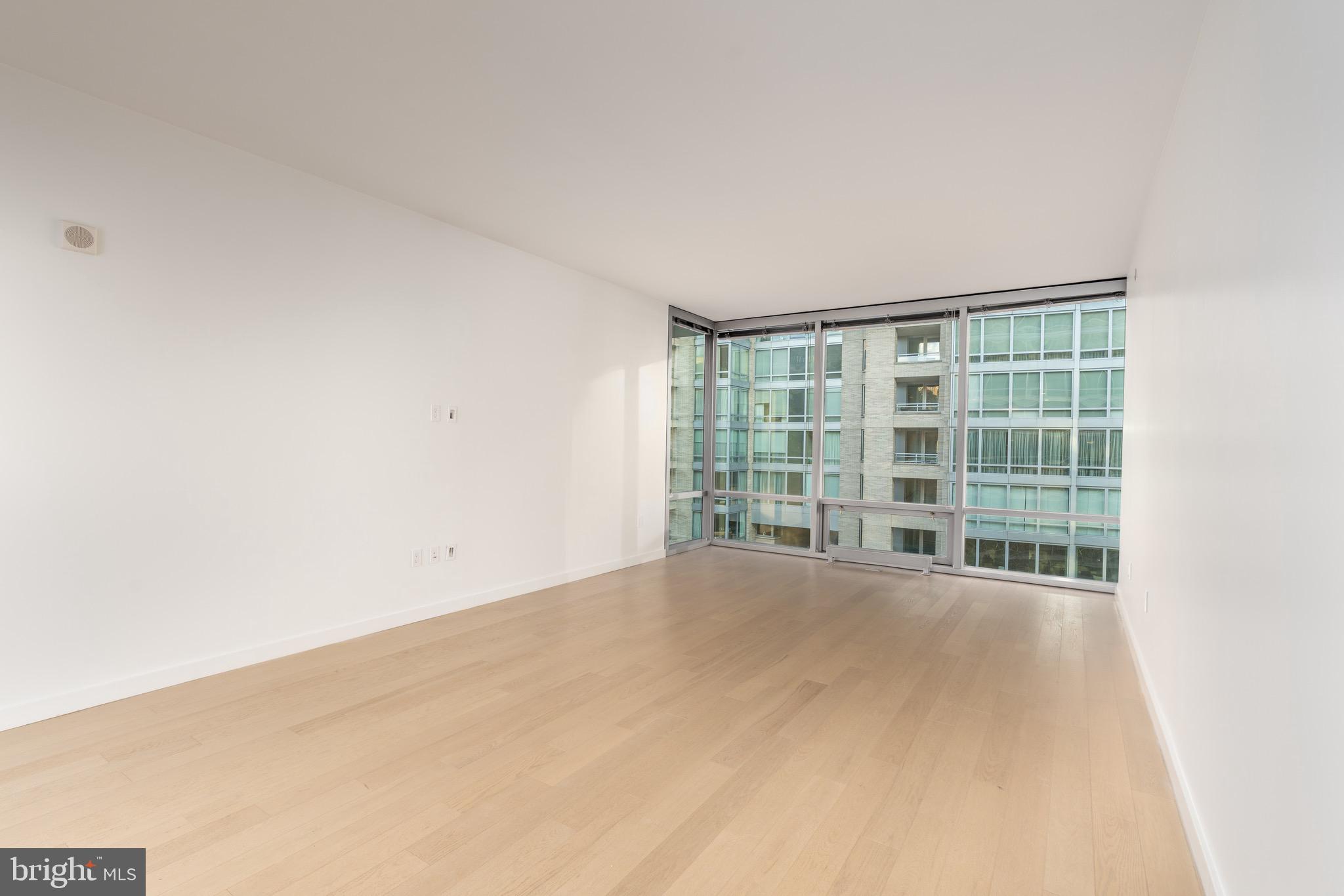 1110 23rd Street Northwest, Unit 505 Washington, DC 20037 - Photo 14 of 25 an empty room with windows