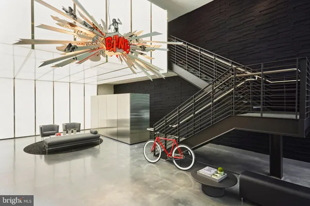 a view of a patio with two chairs and a potted plant
