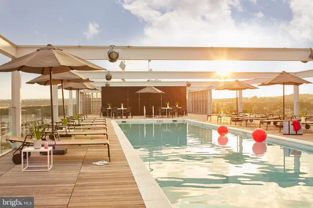 a view of a swimming pool with a lounge chairs