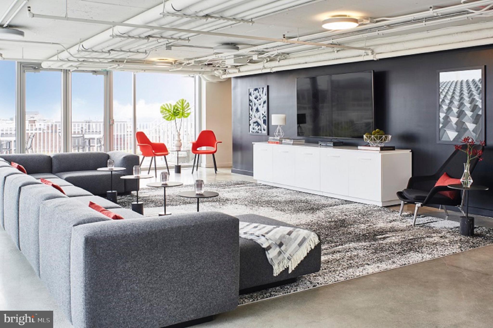 1110 23rd Street Northwest, Unit 505 Washington, DC 20037 - Photo 18 of 25 a living room with furniture and a flat screen tv