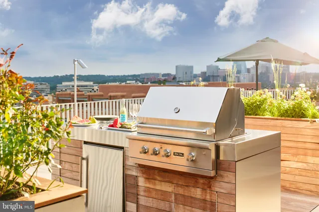 a view of a kitchen with a sink and dishwasher