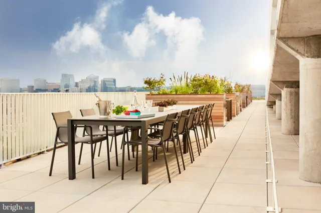 a view of dinning table and chairs in patio