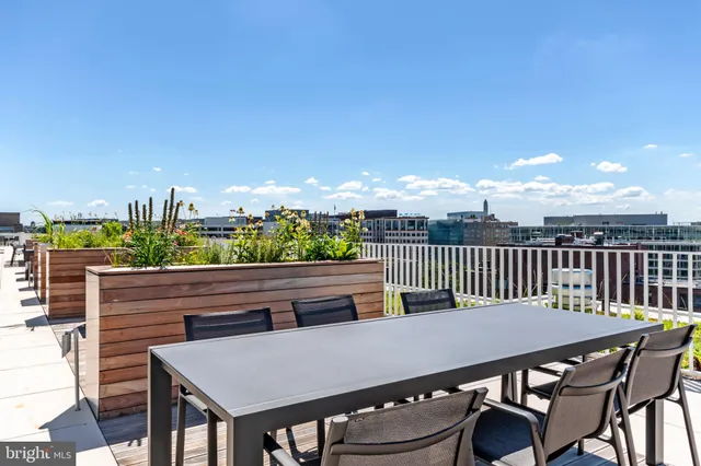 a view of a balcony with furniture